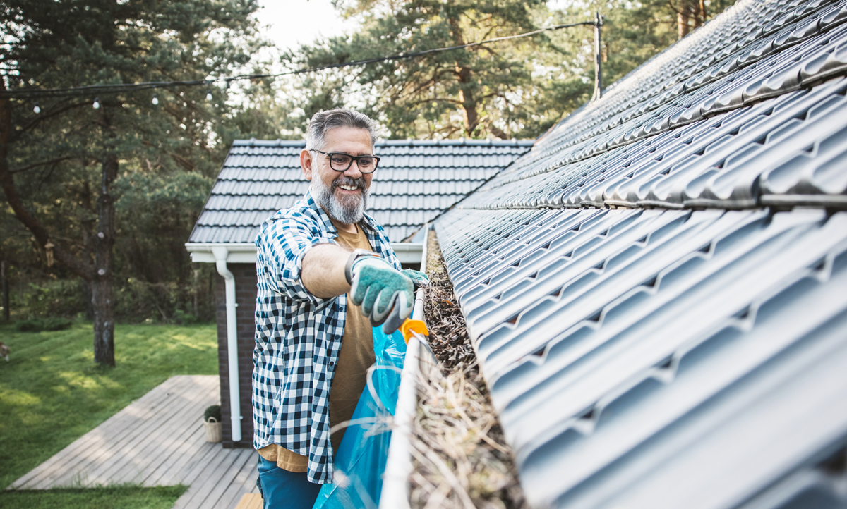 Image of Man fixing Roof after Spring Storm